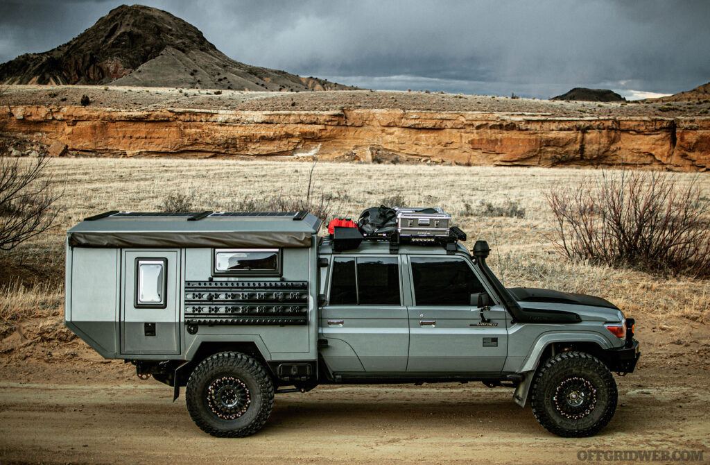 Photo of a 70-Series Toyota Land Cruiser driving through the desert.