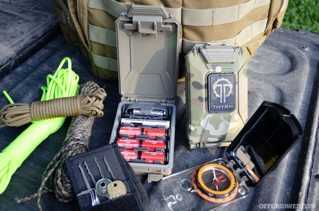 Photo of tools like a compass and rope that could be packed into a go bag.