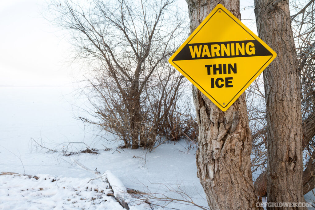 A diamond shaped warning sign that reads, 