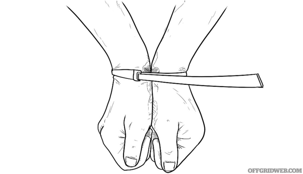 Hand drawn sketch of how to hold your hands if you are being restrained with zip ties. This photo was submitted for the readers survival tips column.