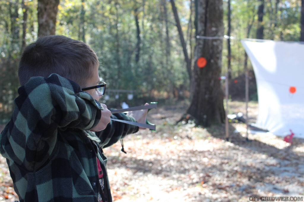 Slingshot shooter takes aim with proper technique.