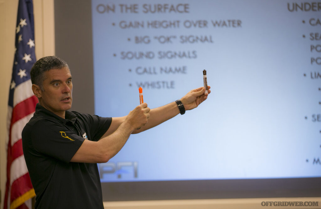 Photo of Kirk Krack teaching in front of a dry erase board.