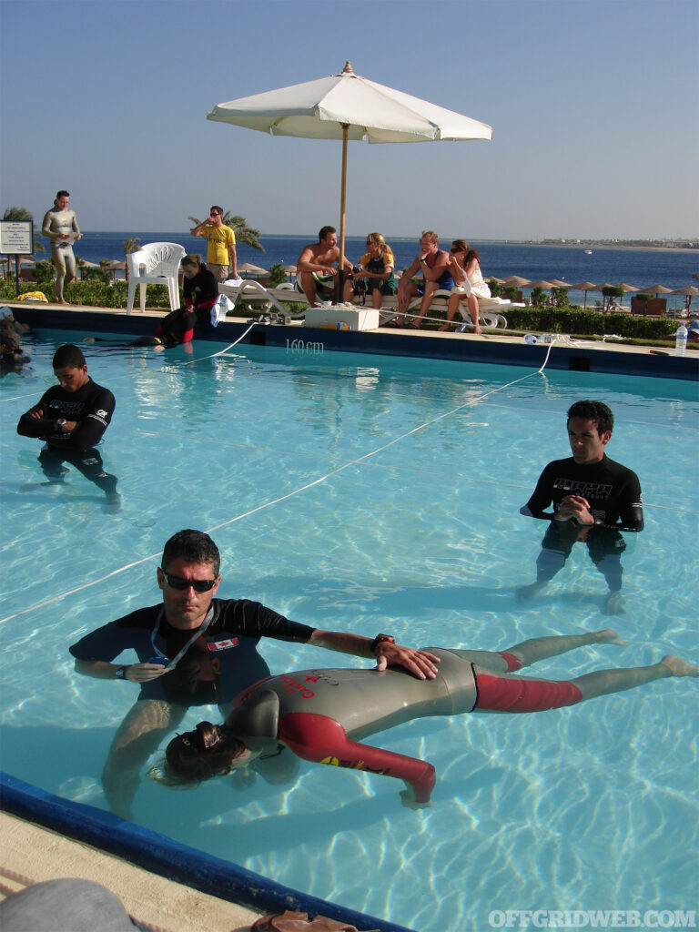 Photo of Kirk Krack coaching Team Canada's Mandy-Rae in survival breathing at World Championships in Egypt.