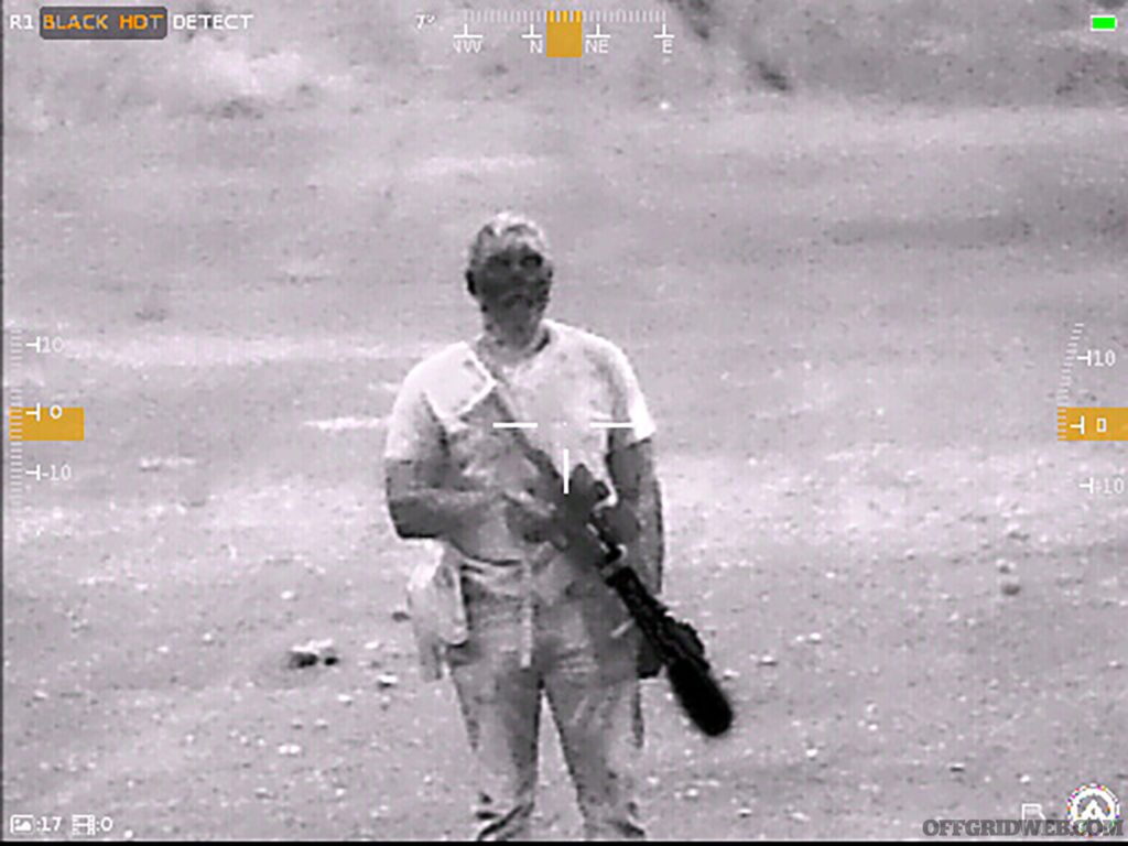 View of a man with a rifle through the Contractor 320.