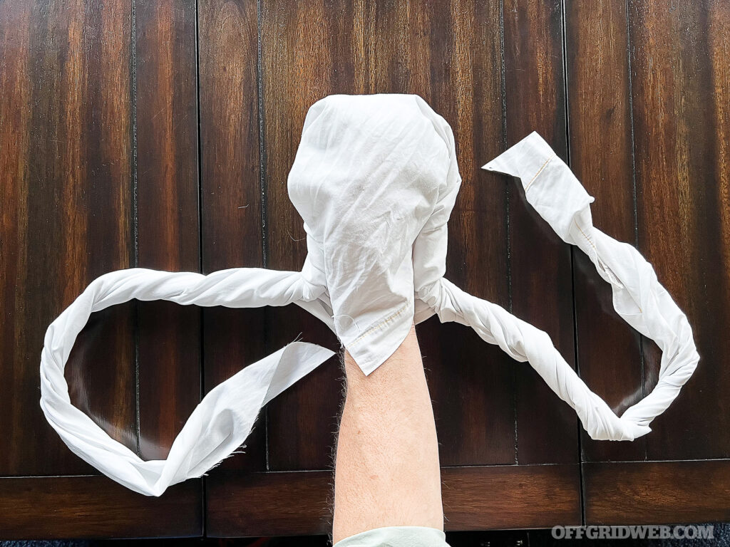 Creating tails with the bandage to tie off a bandaged hand.